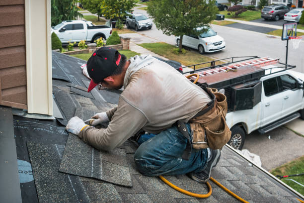 Professional Roofing technician working in Hadley, NY